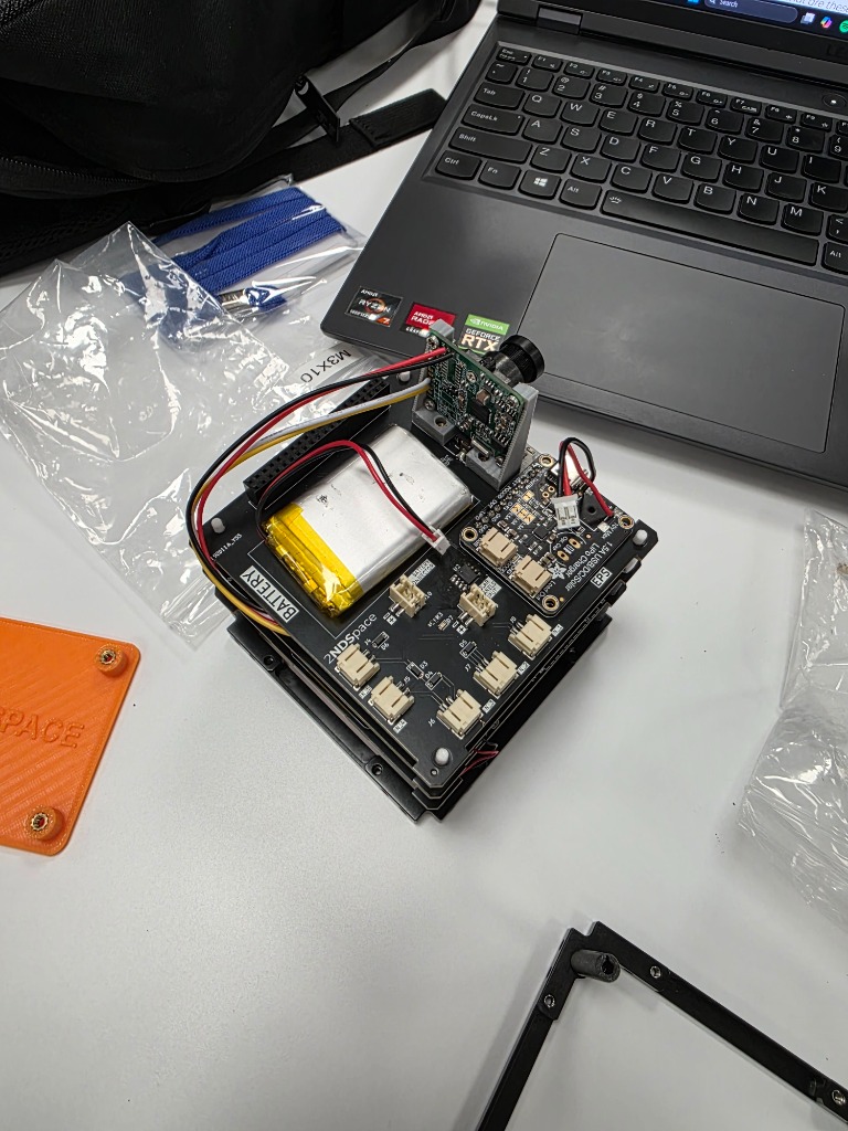 Top-down view of camera module and battery
