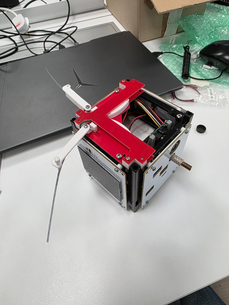 CubeSat with measuring tape antennas deployed